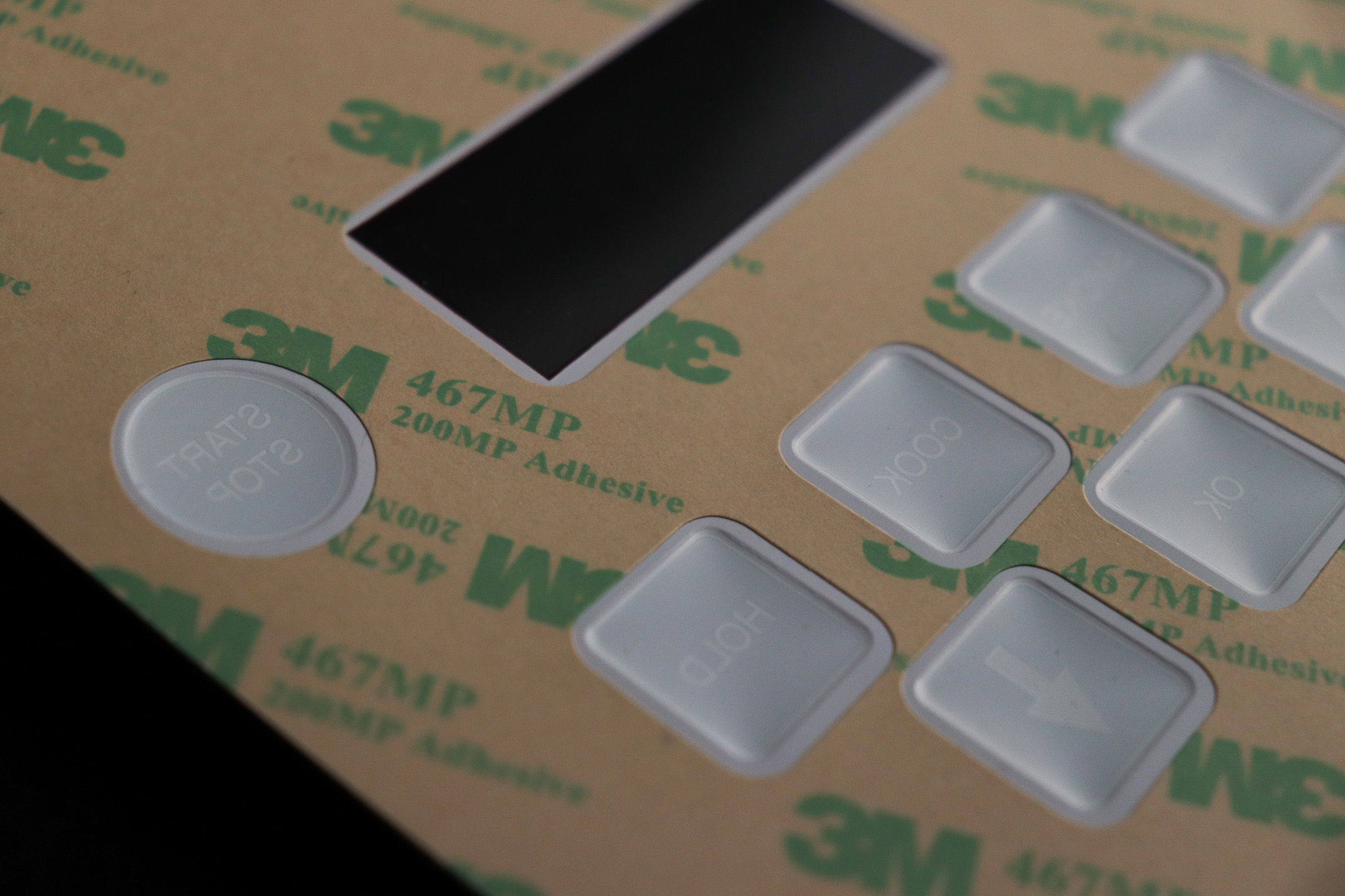 Embossed Buttons on a Polycarbonate Overlay with a Window