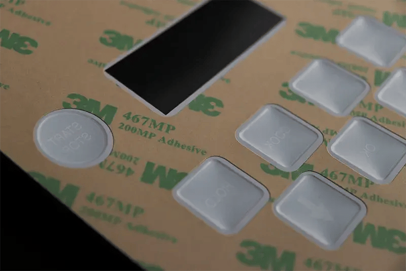Selective Adhesive on Polycarbonate Overlay
